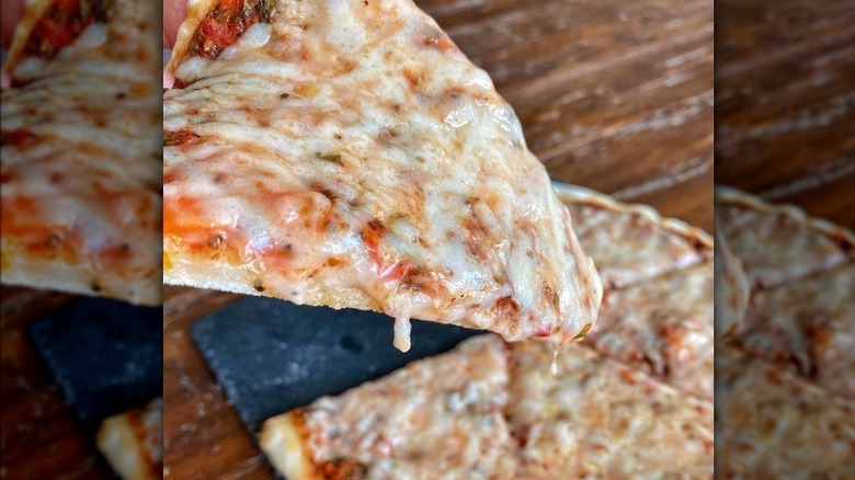 Slice of pizza over pie