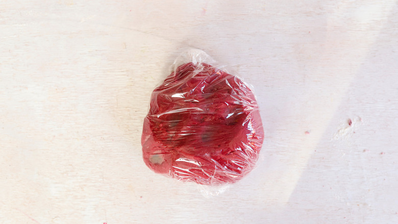 beet dough wrapped in plastic wrap