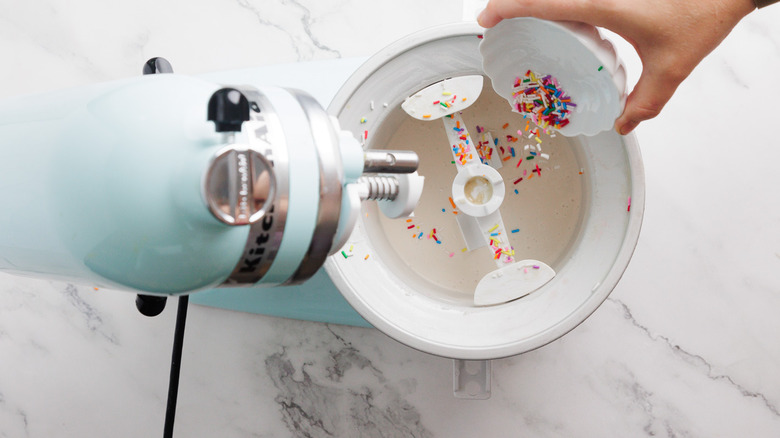 Churning ice cream with sprinkles