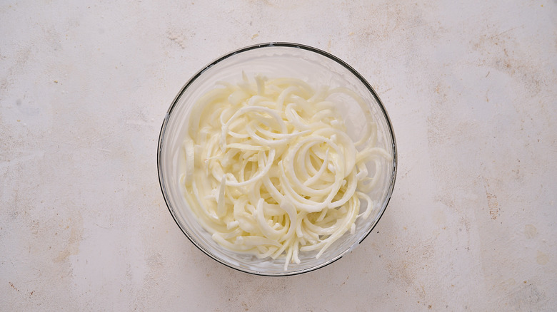 onions and buttermilk in bowl