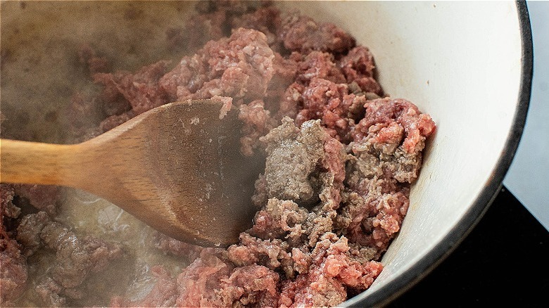 browning meat in pot