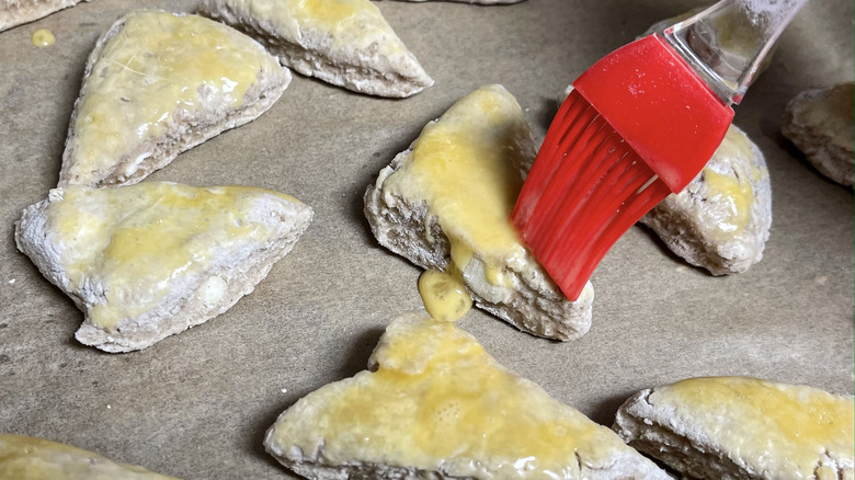 pastry brush over unbaked scones