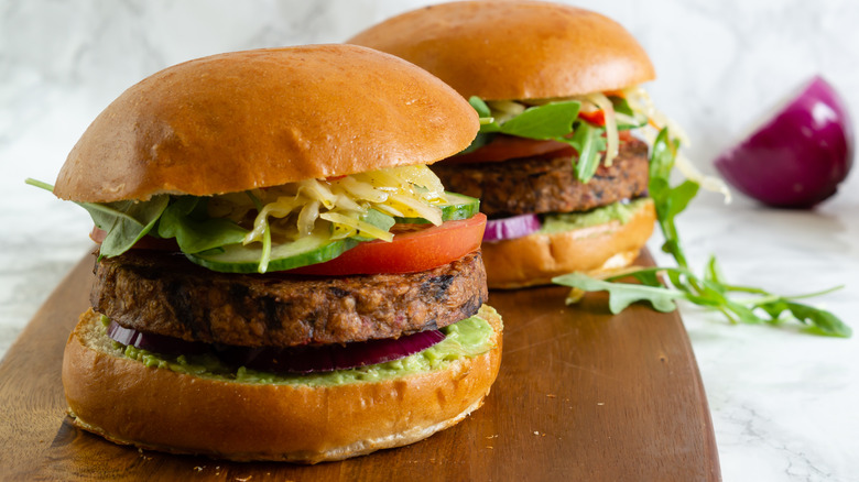 black bean burgers on wood board