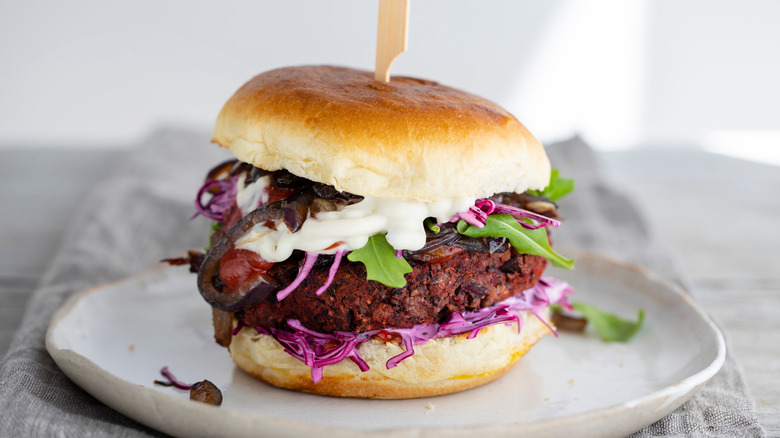 beet and black bean burger on gray plate