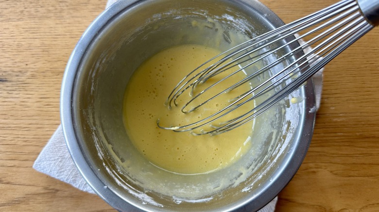 Whisked egg yolks in bowl