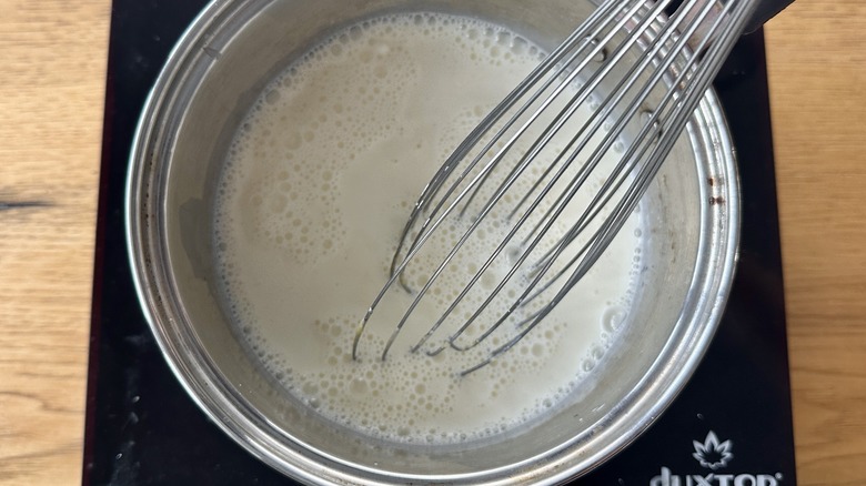 Heating cream and milk in a pot