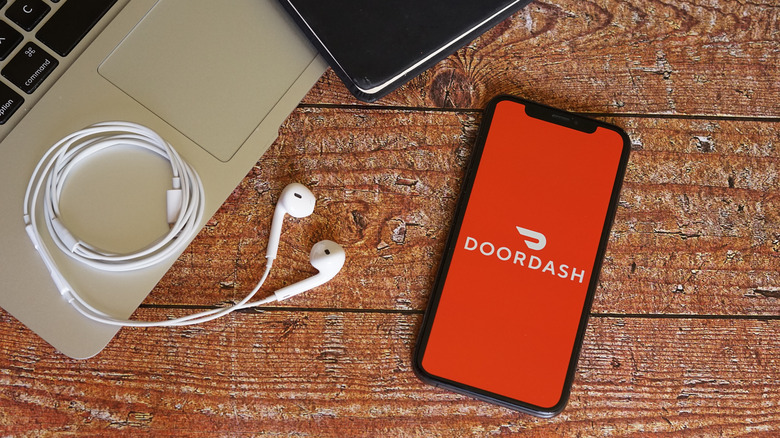 DoorDash app on phone, desk