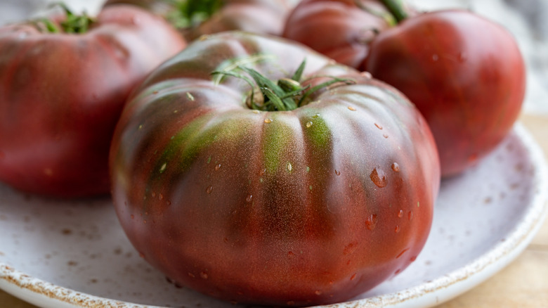 Black Krim tomatoes on plate