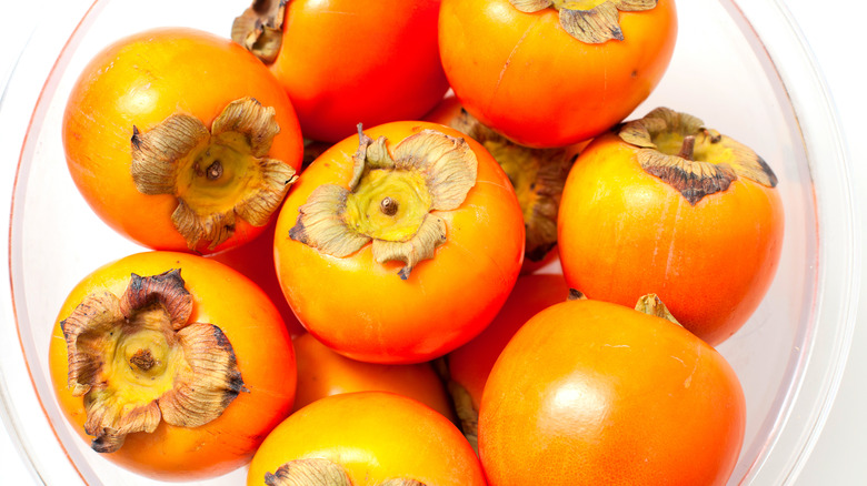 Persimmons in bowl