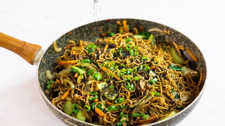 adding sesame to stir fry