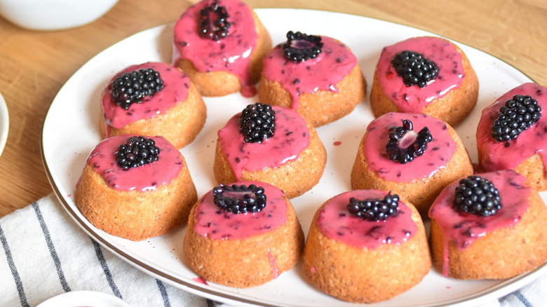 small cakes with blackberry topping