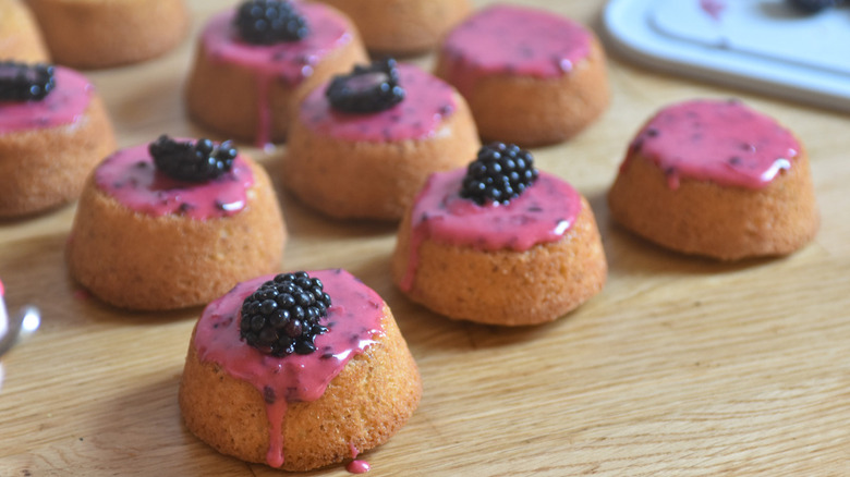 small cakes with blackberry topping