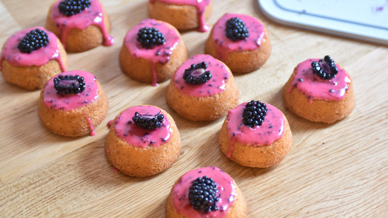 small cakes with blackberry topping