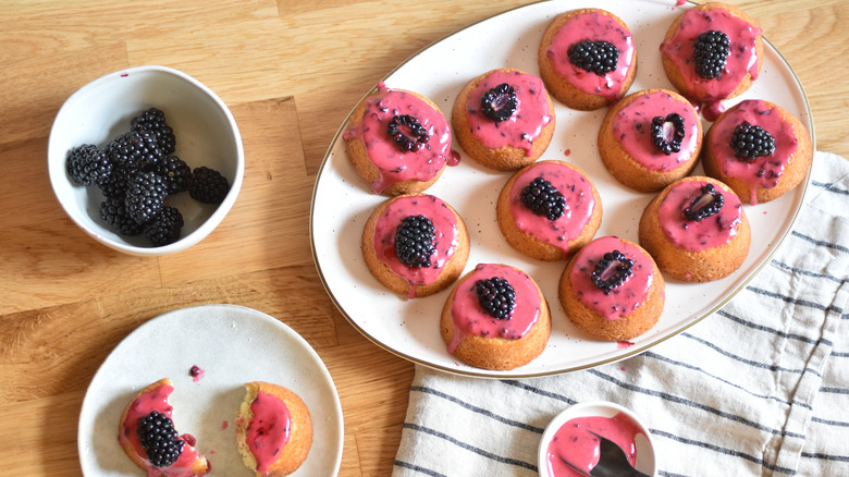 small cakes with blackberry topping