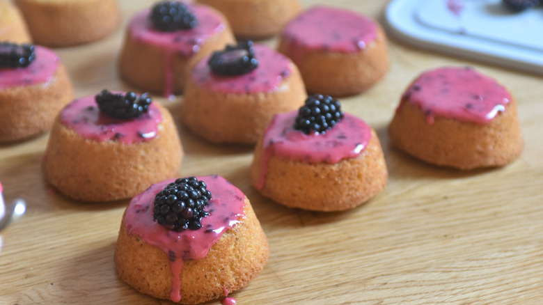 small cakes with blackberry topping