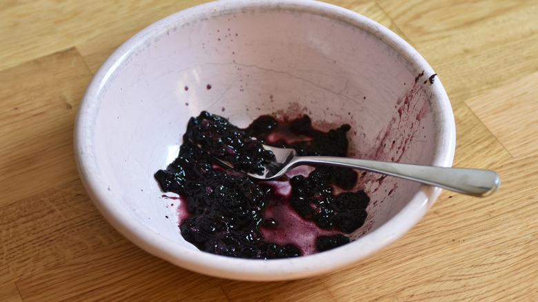 blackberries in bowl with spoon