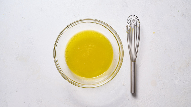 whisking dressing in bowl