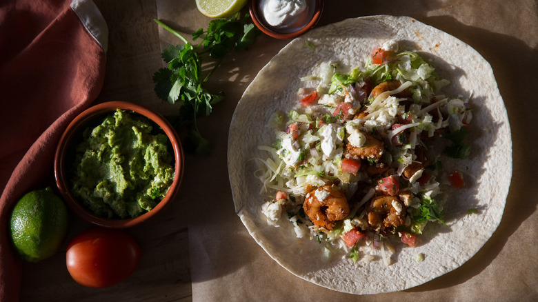 open shrimp burrito on table 