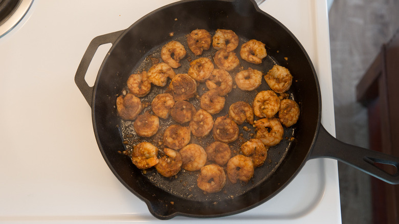 shrimp cooking in heavy skillet 