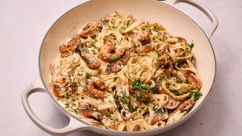 Steak and shrimp Alfredo in skillet