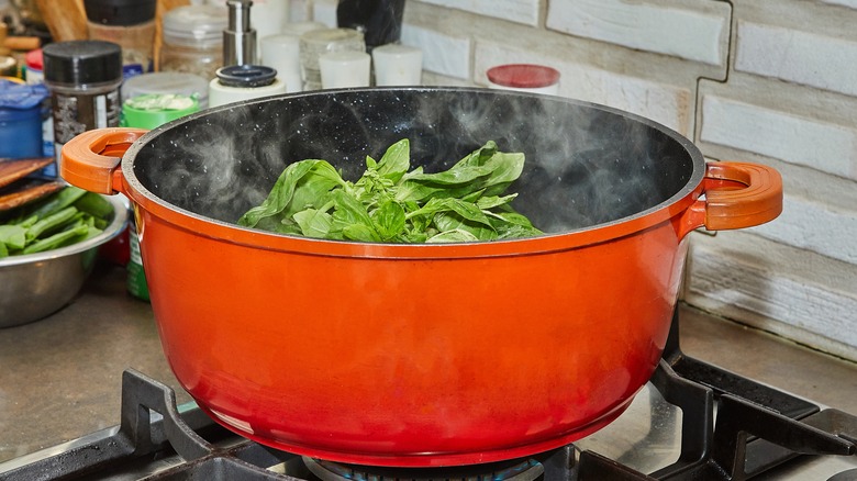 basil blanching in pot