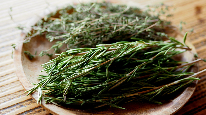 poultry herbs in wooden bowl