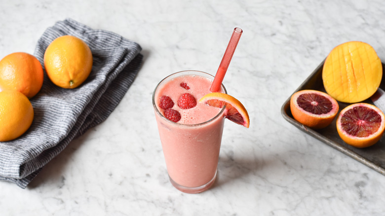 tropical blood orange smoothie in tall glass