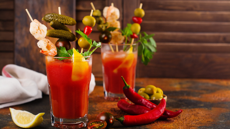 Two Bloody Marys with garnishes