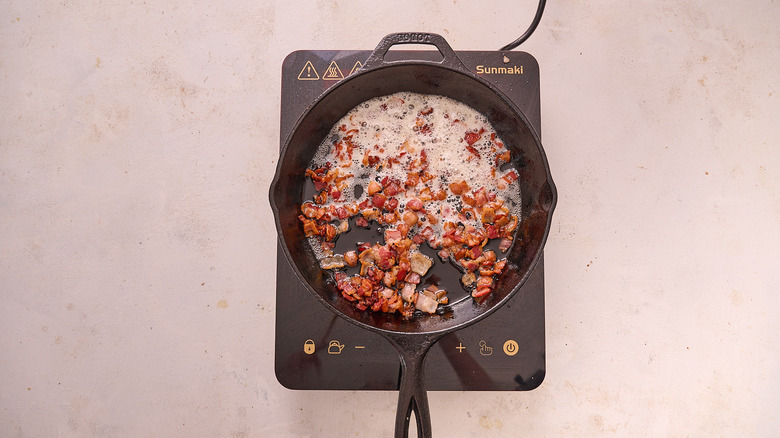 cooking bacon in skillet