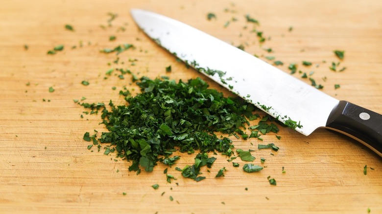chopped parsley with knife