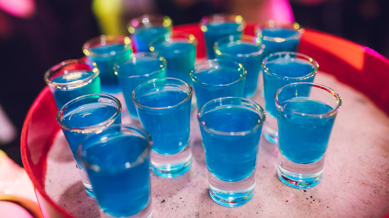 Blue cocktail shots on tray