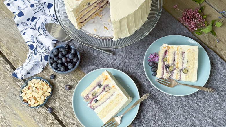 Blueberry and almond Chatilly cake with slices on table