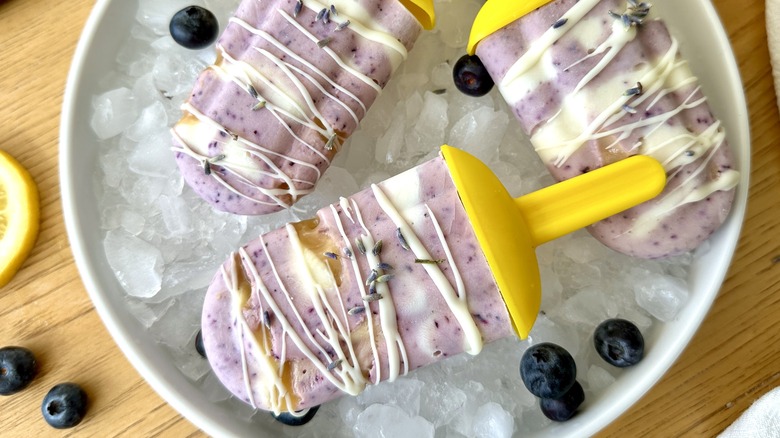 Blueberry-lavender honey popsicles on ice