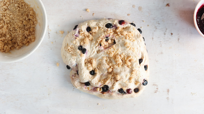 streusel sprinkled on sheet of dough