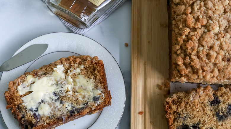 slice of blueberry bread with butter