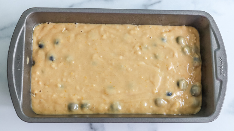 blueberry pancake bread batter spread in pan