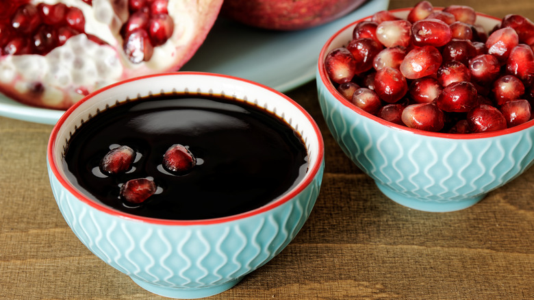 pomegranate molasses with seeds in bowl