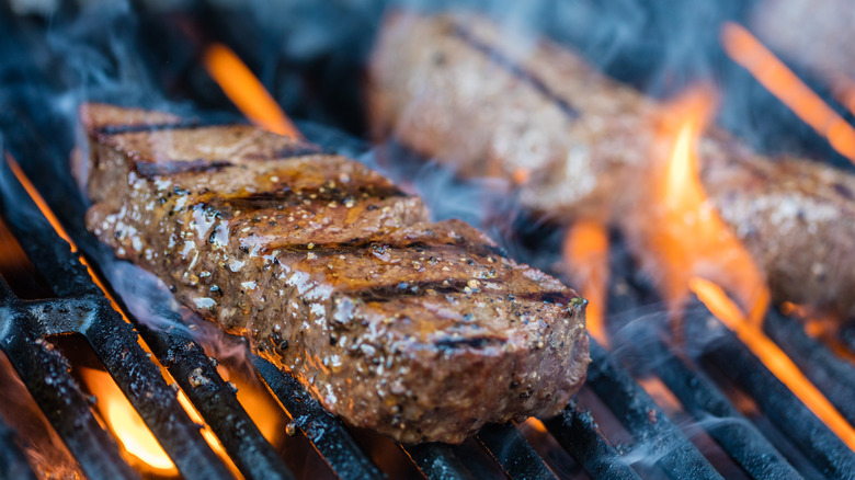 Smoking steak on a grill