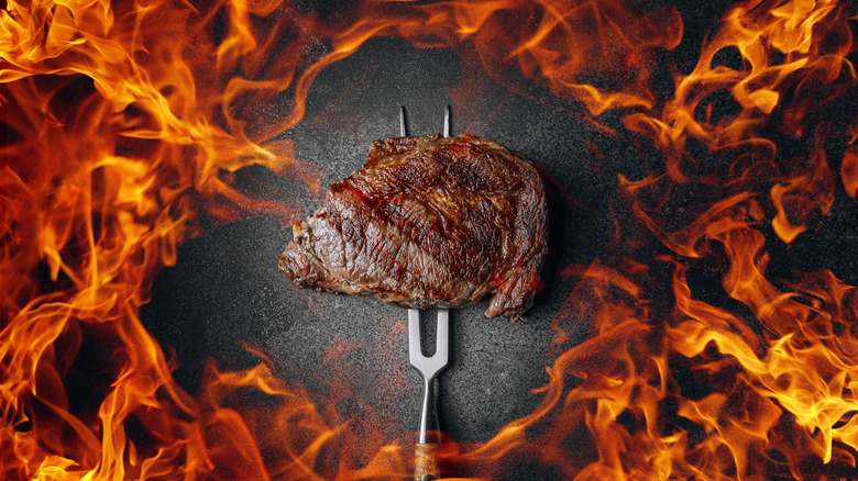 Steak surrounded by fire