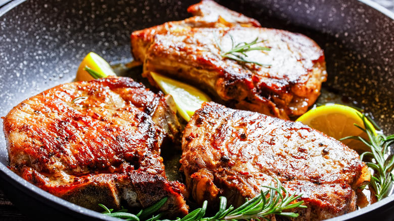 Pork chops in a frying pan