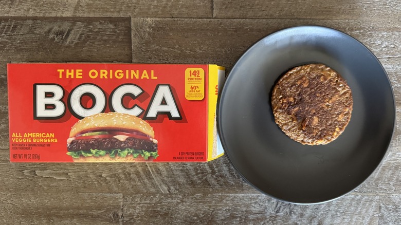 Boca All American burger box on wooden table next to a cooked patty