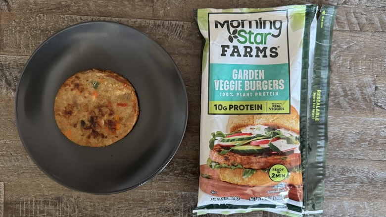 MorningStar Farms garden veggie burger package next to cooked patty on a plate