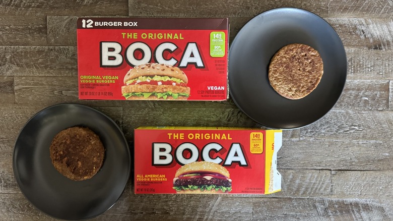 Boca burger boxes on a wooden table next to plates with cooked patties on them