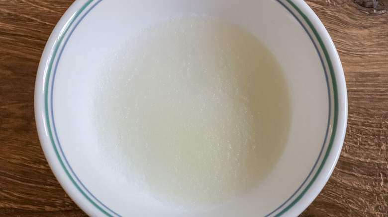 Gelatin being bloomed in a bowl