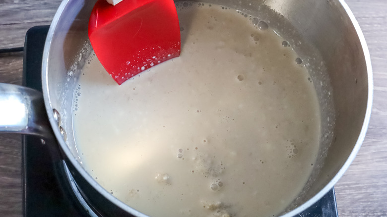 Irish cream layer ingredients in a saucepan