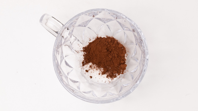 cup with cocoa and sugar