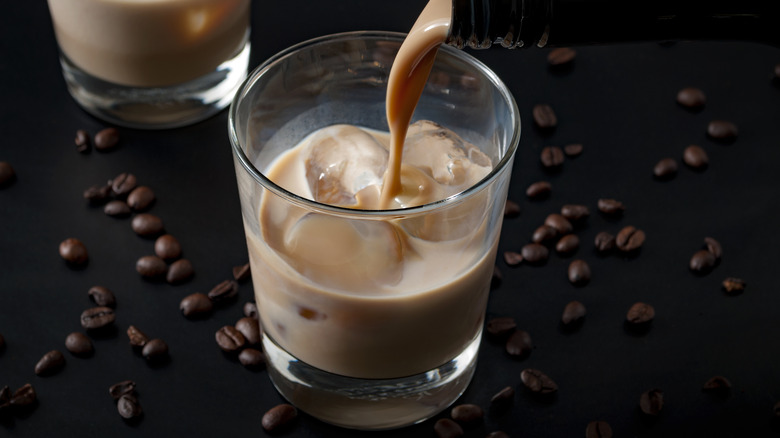 Pouring Irish cream into coffee