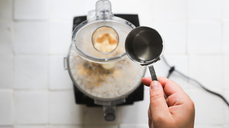 Adding water to dough