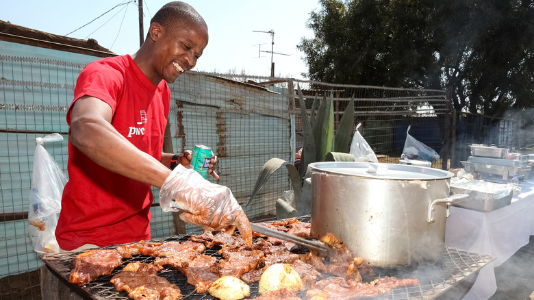 man preparing braai