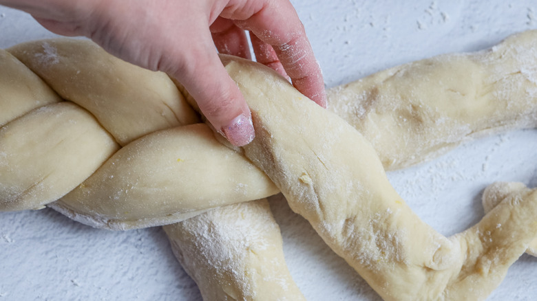 braided easter bread being shaped